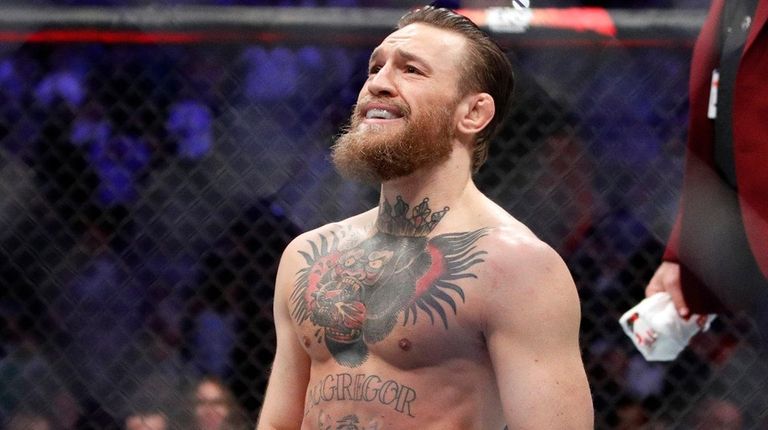 Conor McGregor smiles after defeating Donald "Cowboy" Cerrone