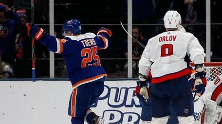 Devon Toews of the Islanders celebrates his second-period