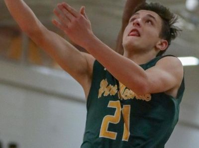 Ward Melville's Tommy Ribaudo #21 goes up for