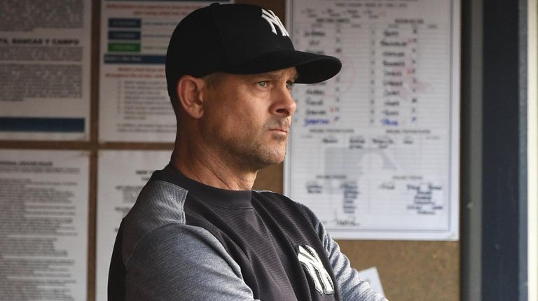Yankees manager Aaron Boone looks on from the