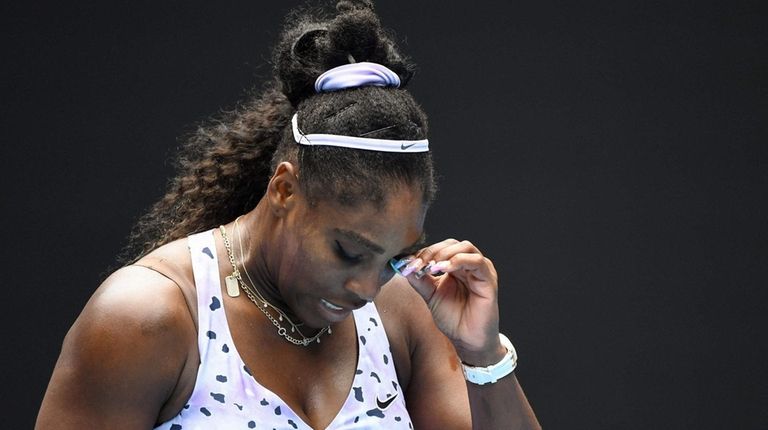 Serena Williams reacts after a point against China's