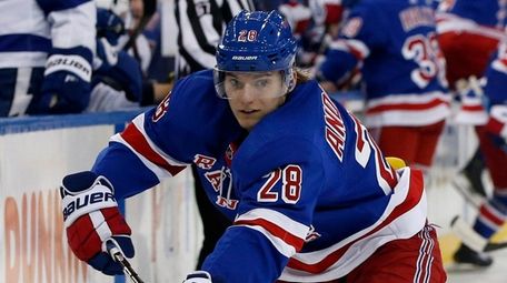 Lias Andersson of the Rangers plays the puck