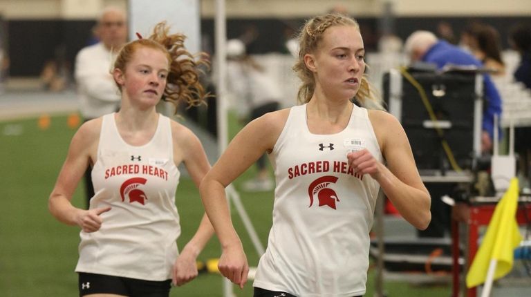 Sacred Heart's Maggie Maier leads the 1,500-meter run