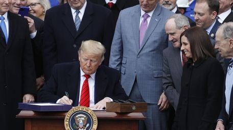President Donald Trump signs the U.S.-Mexico-Canada Agreement (USMCA)