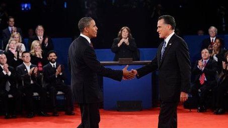 President Barack Obama shakes hands with Republican presidential