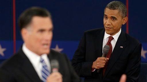 President Barack Obama listens as Republican presidential nominee