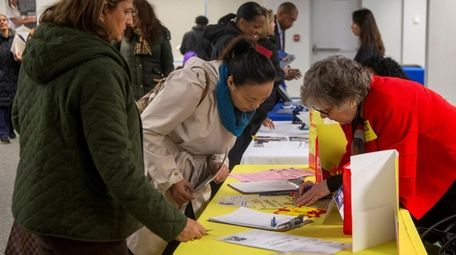 Applicants attend a job fair at the Joseph