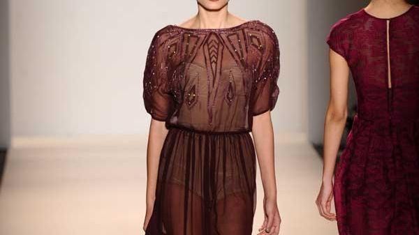A model walks the runway at the Lela