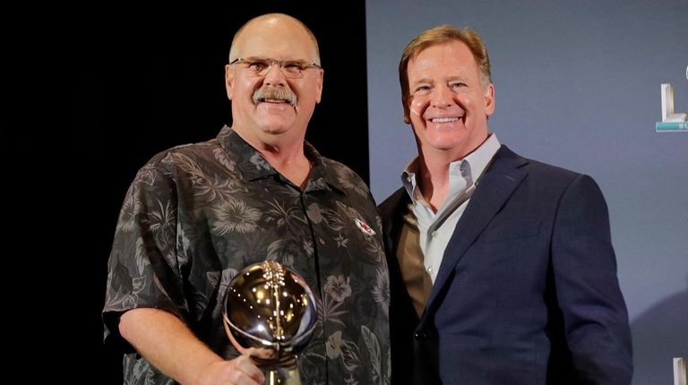 Kansas City Chiefs head coach Andy Reid holds