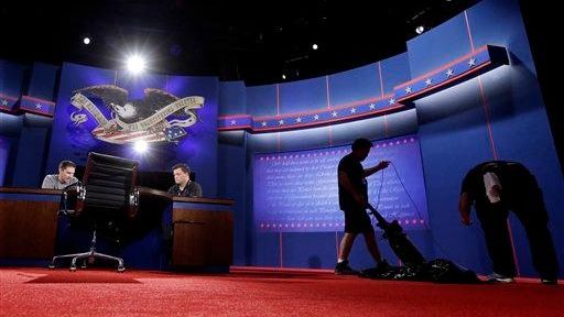 Workers prepare the set for Monday's presidential debate