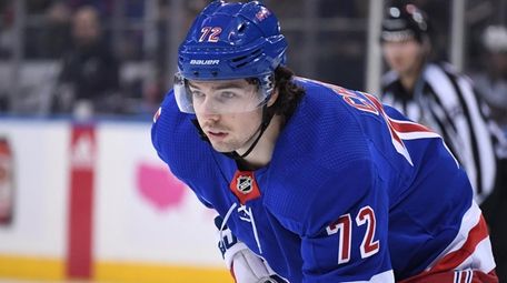 Rangers center Filip Chytil sets before a face-off
