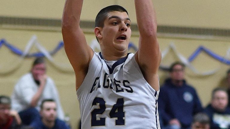 Matt Lane of Bethpage drives to the net