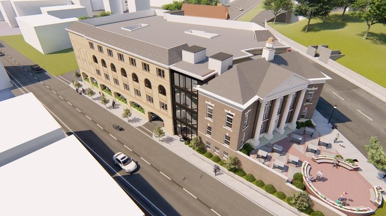 An architect's rendering shows the proposed Hampton Inn,