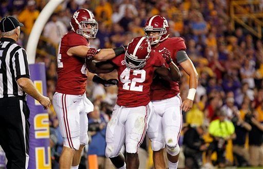 Alabama running back Eddie Lacy (42) celebrates his