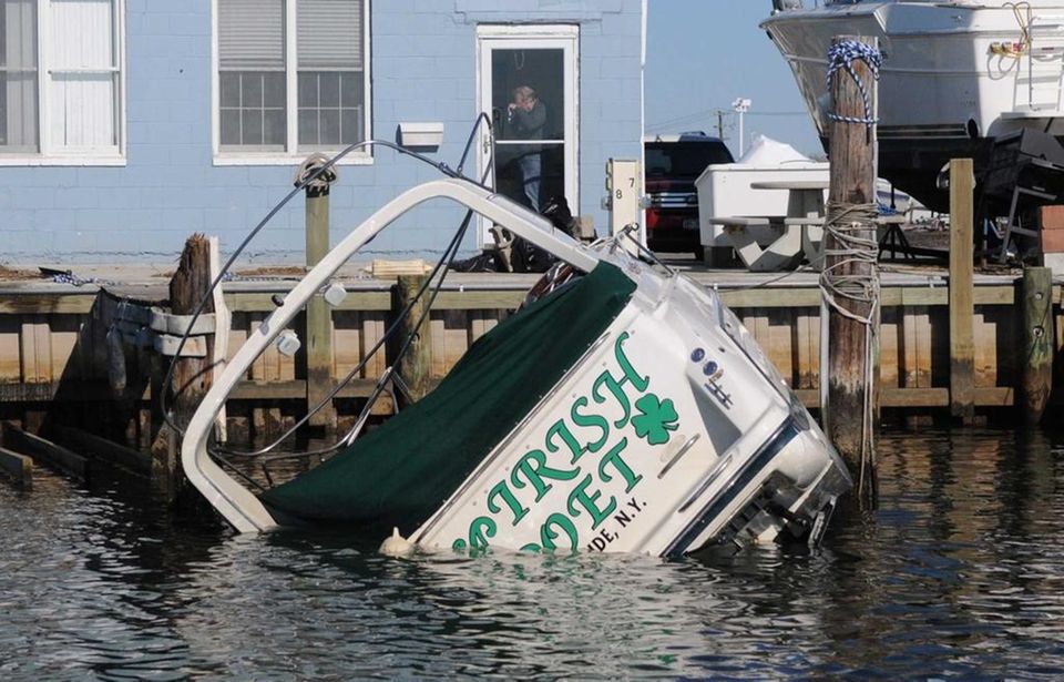 A boat takes on water after being damaged