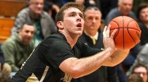 Commack's Spencer Malloy #32 sets to shoot from