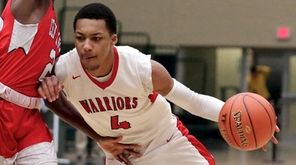 Amityville forward Divaahd Lucas drives the basket as