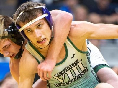 George Oroudjov of Syosset wrestles against Zack Ryder