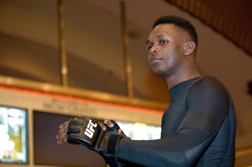 UFC middleweight champion Israel Adesanya, of Nigeria, prepares