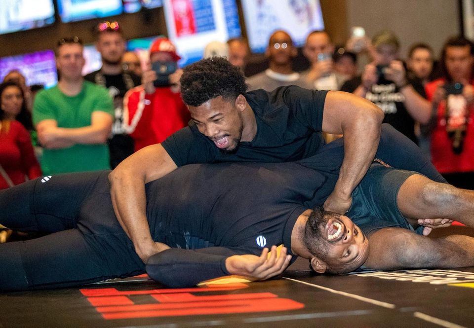 Middleweight fighter Yoel Romero, bottom, of Cuba wrestles