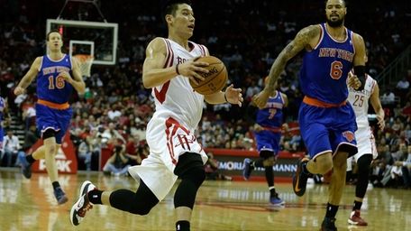 Houston Rockets guard Jeremy Lin drives upcourt past