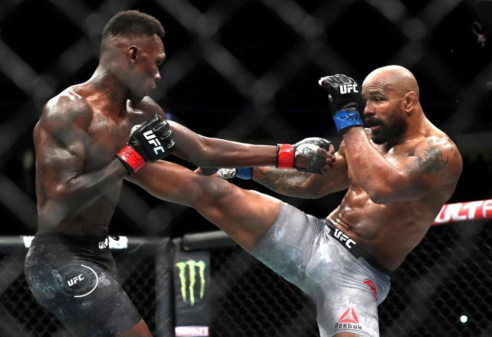 Yoel Romero of Cuba kicks UFC middleweight champion
