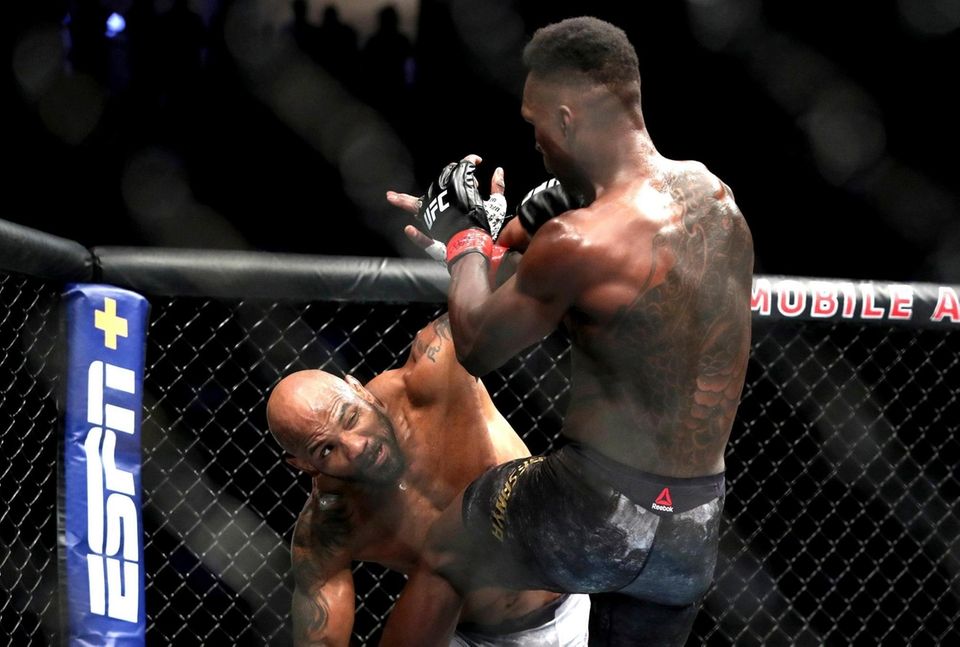 Yoel Romero of Cuba punches UFC middleweight champion