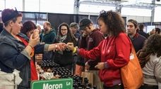 People taste testing at the Hot Sauce Expo