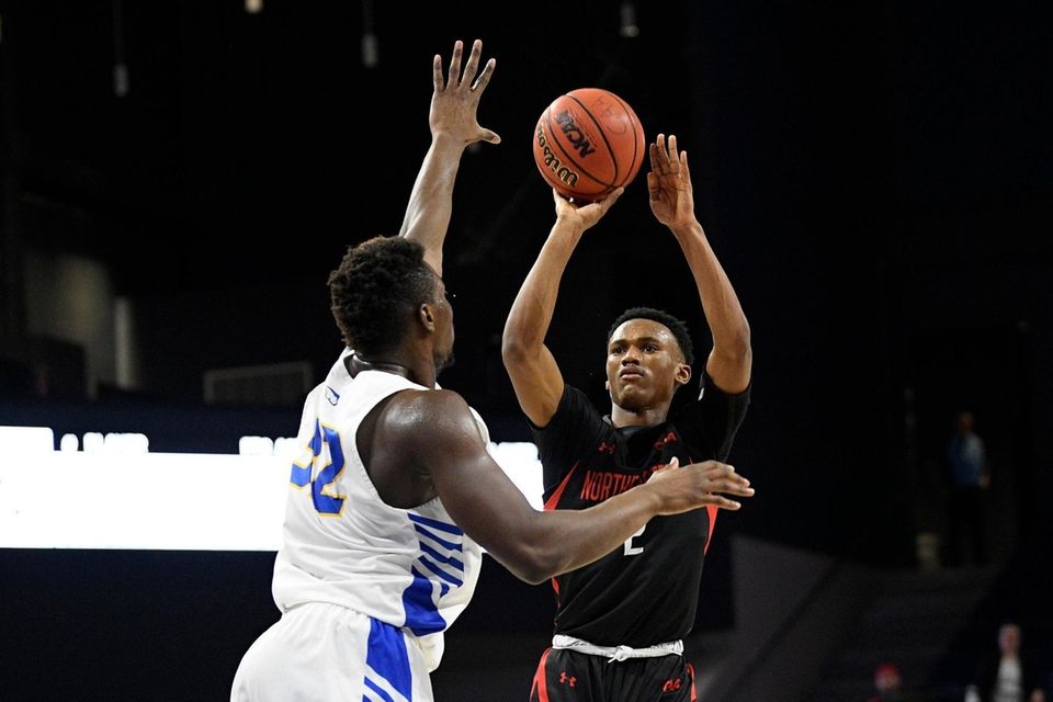 Northeastern guard Tyson Walker (2) shoots against Hofstra