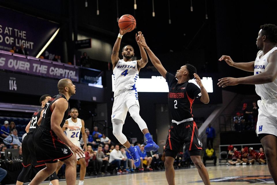Hofstra guard Desure Buie (4) passes the ball