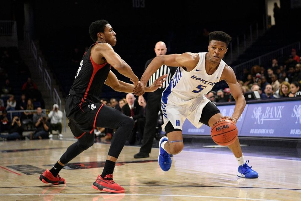 Hofstra guard Eli Pemberton (5) is defended by