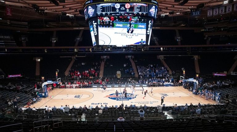 A few basketball fans watch as Creighton takes