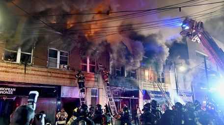 Firefighters battle a blaze on Main Street in