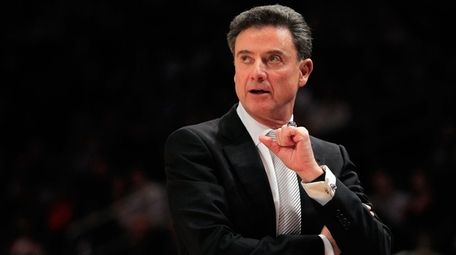 Then-Louisville head coach Rick Pitino shouts from the