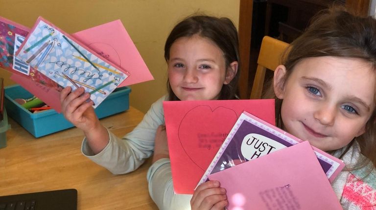 Abigail Cooper, 7, and her sister Emma, 5,