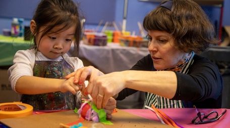 Harper Liao, 4, Brooklyn,works with artist Julie Peppito