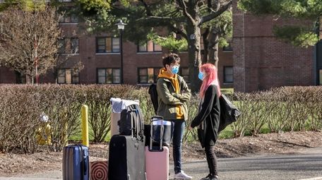 Two Stony Brook University students wait to be