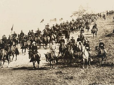 Col. Theodore Roosevelt riding in with the Rough