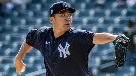 Yankees pitcher Masahiro Tanaka throws during spring training