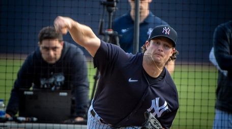 Yankees pitcher Gerrit Cole throws during spring training
