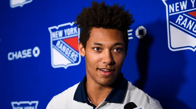 Rangers prospect K'Andre Miller speaks during a media