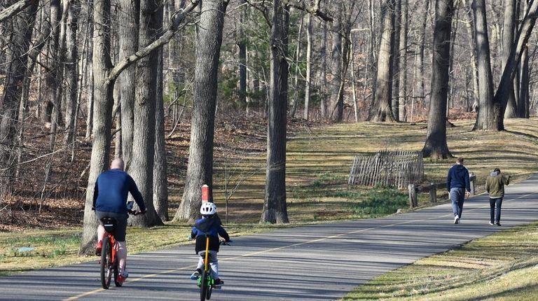 Bikers and walkers share the paved paths that