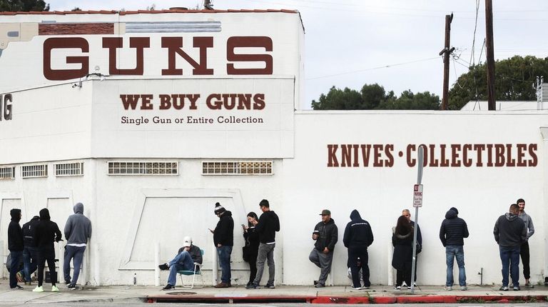 People stand in line outside the Martin B.