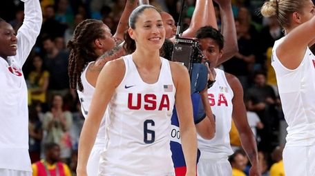 Team USA's Sue Bird celebrates after winning the