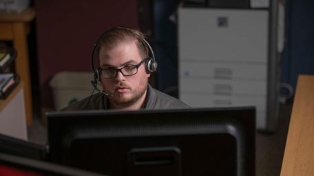 An employee answers calls at a state Department