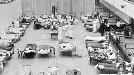 Volunteer nurses from the American Red Cross tend