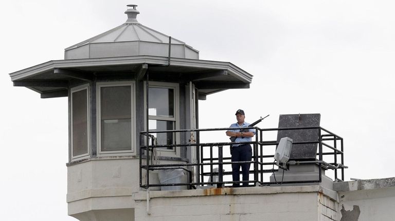 A prison employee stands guard at the Clinton