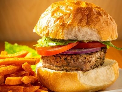 A tuna burger with sweet potato fries at