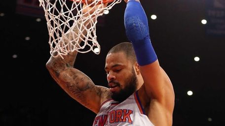 Tyson Chandler dunks the ball in the first