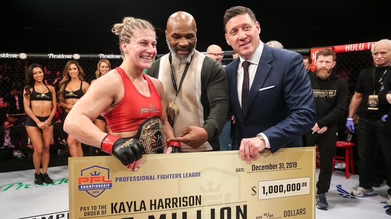 Kayla Harrison celebrates winning the PFL women's lighweight
